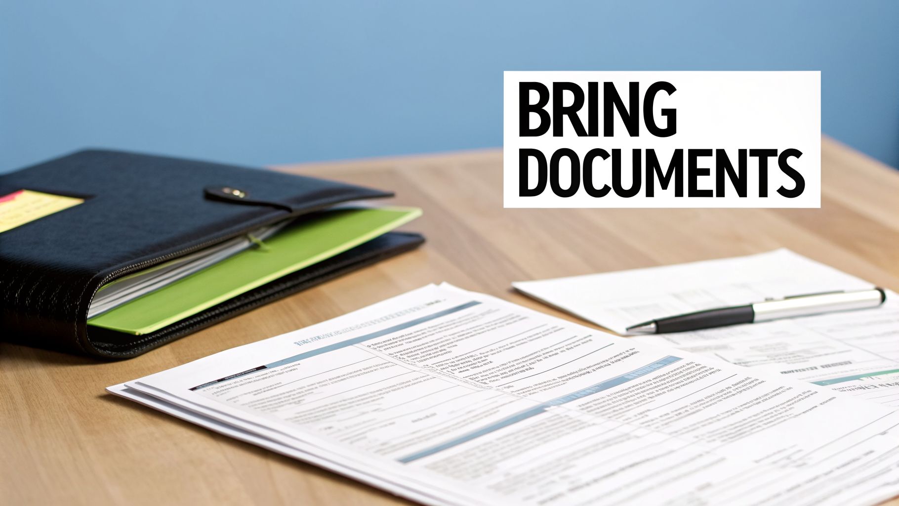 A wooden desk holds a black binder, green folders, scattered documents, a pen, and a 'BRING DOCUMENTS' sign.