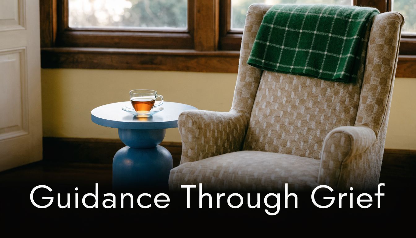 A quiet, comforting reading nook with an armchair, a green blanket, and a cup of tea.