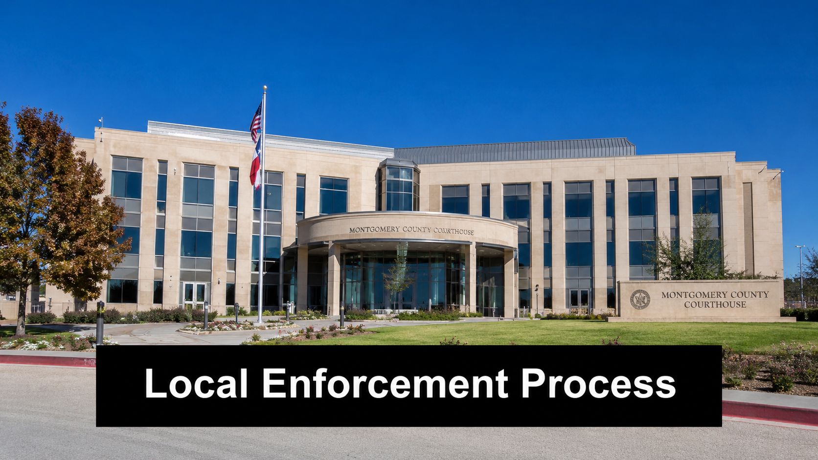 The exterior view of the Montgomery County Courthouse building under a clear blue sky.