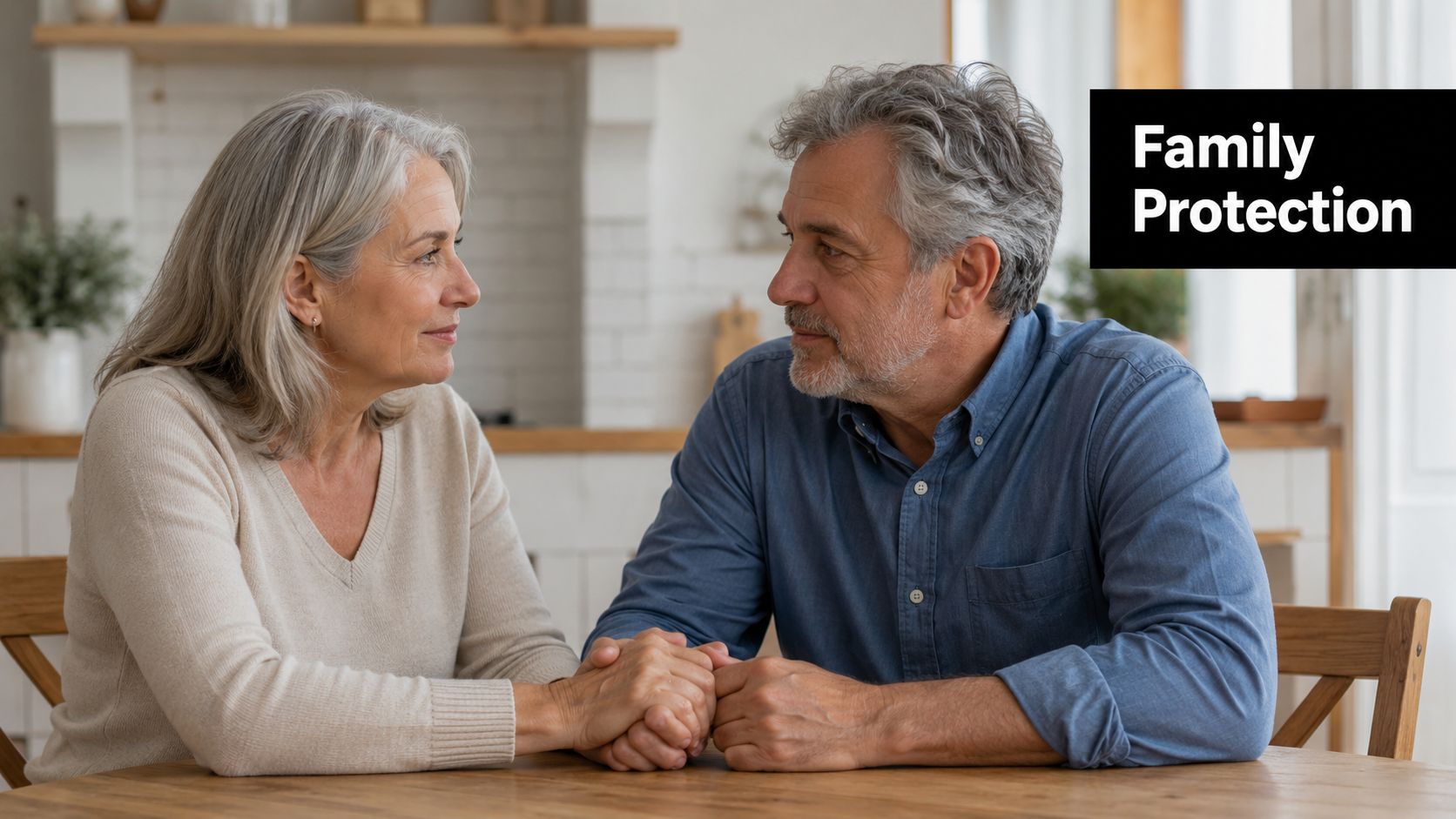 An elderly couple sitting at a wooden table holding hands and looking at each other affectionately.